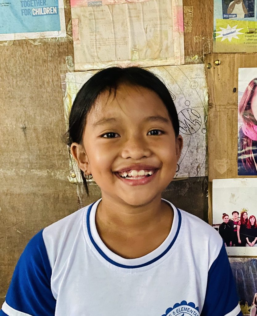 Girl smiles at camera