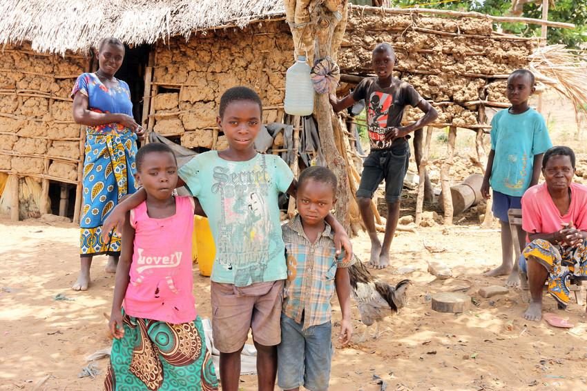 Lack of food often leaves Juma (centre) feeling too weak to attend school