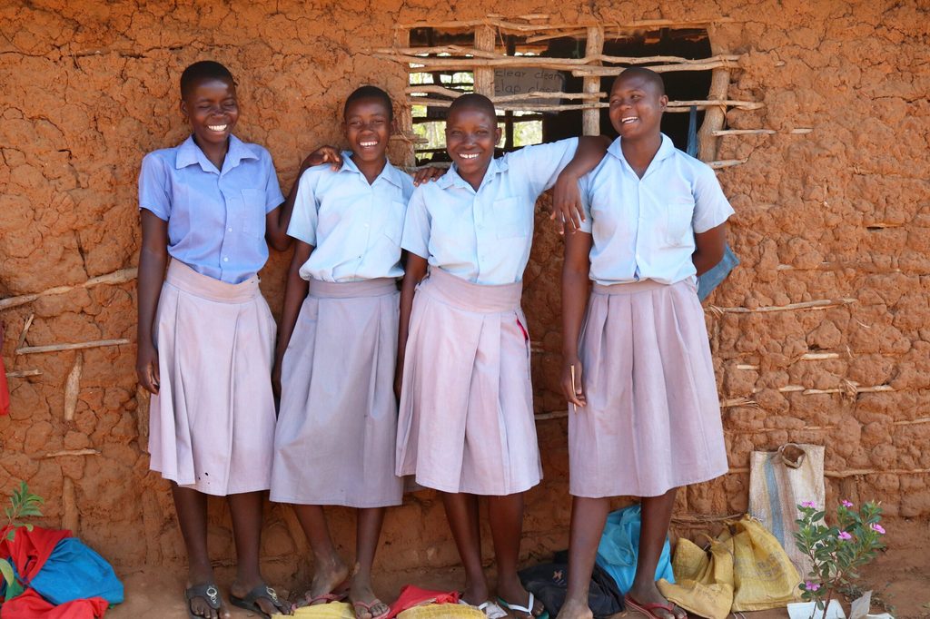 Halima, 15, Kenya, is standing with friends outside their school