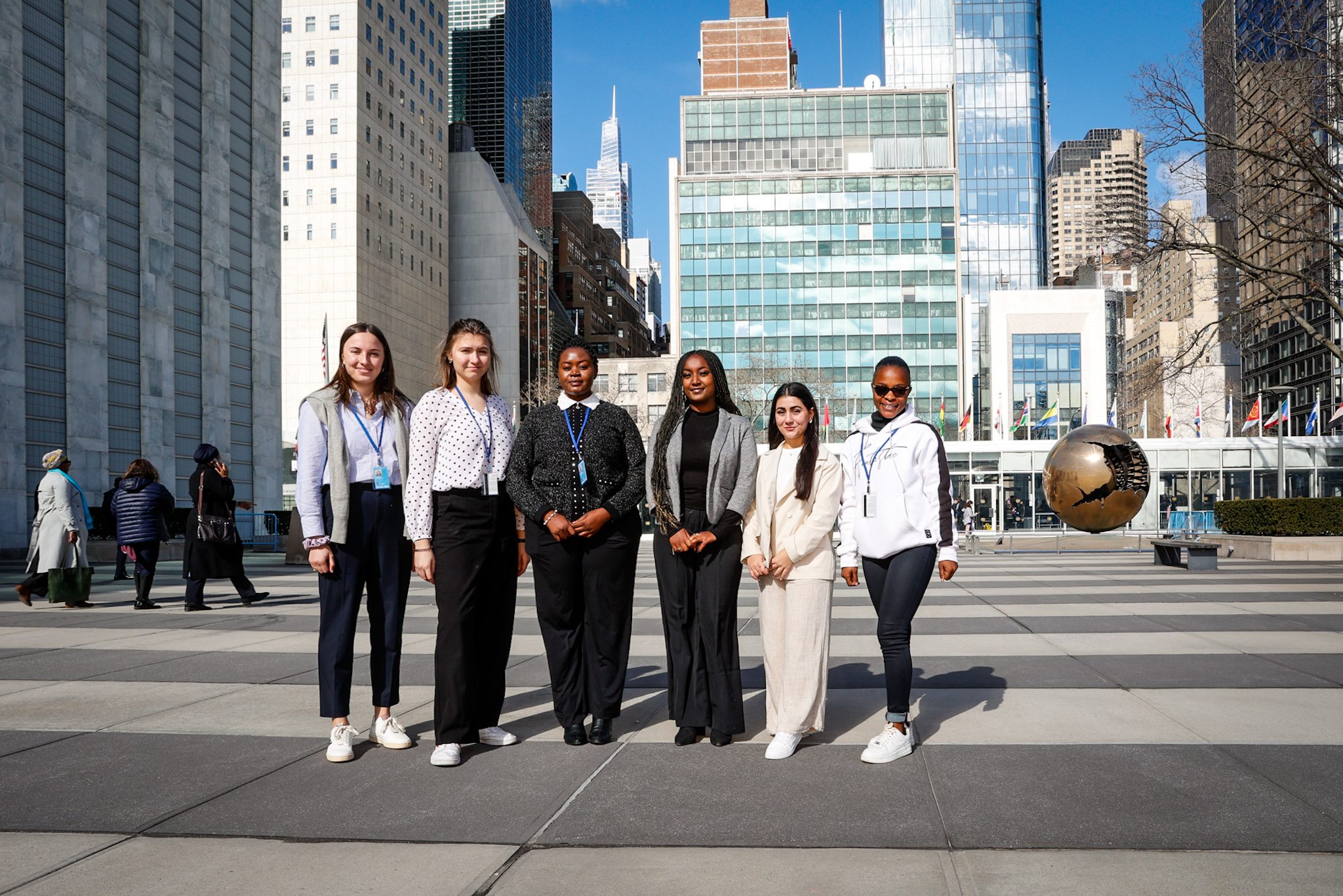 6 young women pose in the UN plaza