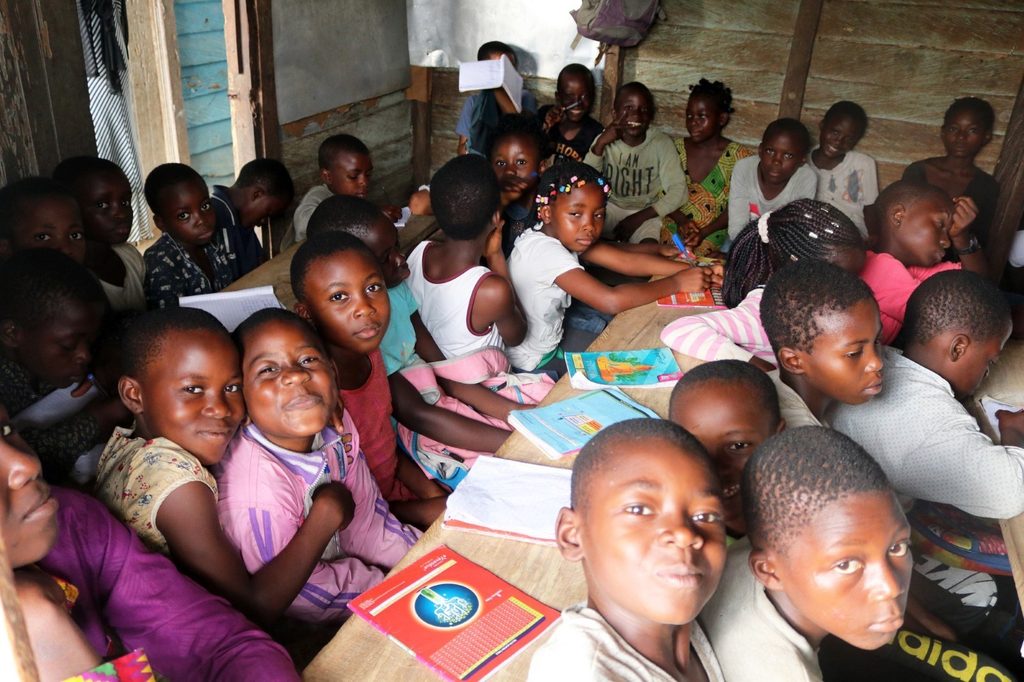 Children in a temporary learning centre for children displaced by conflict in the South-West region of Cameroon. Photo credit: Plan International