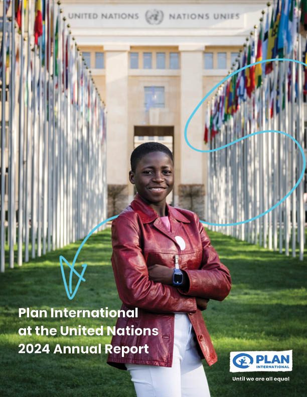 A young girl stands in front of the UN in Geneva, smiling at the camera.