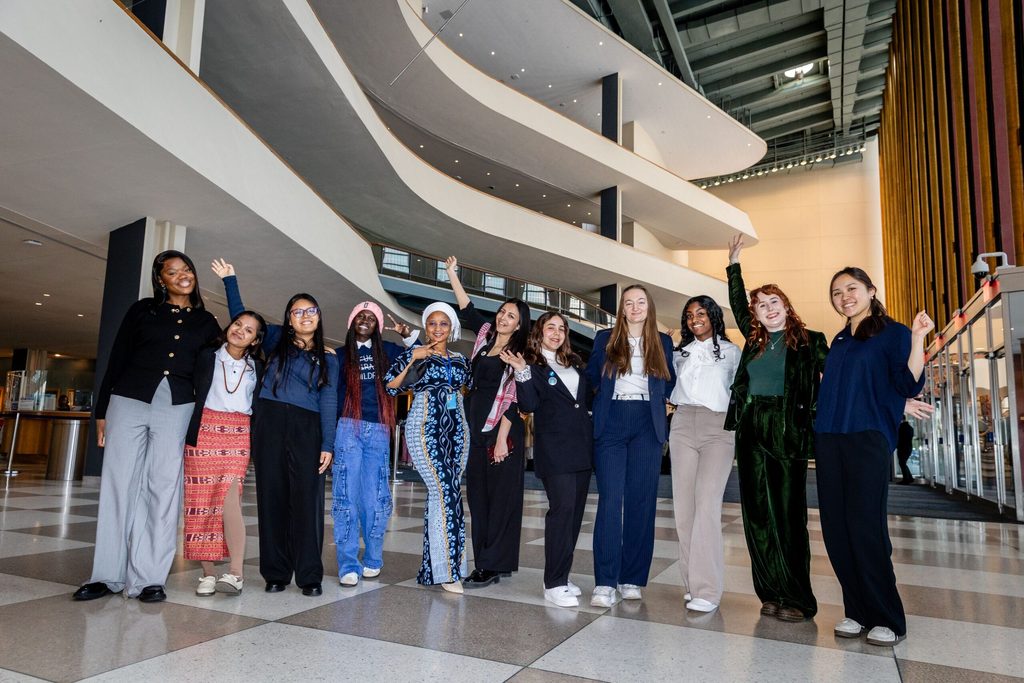 A group of youth advocates pose inside the UN.