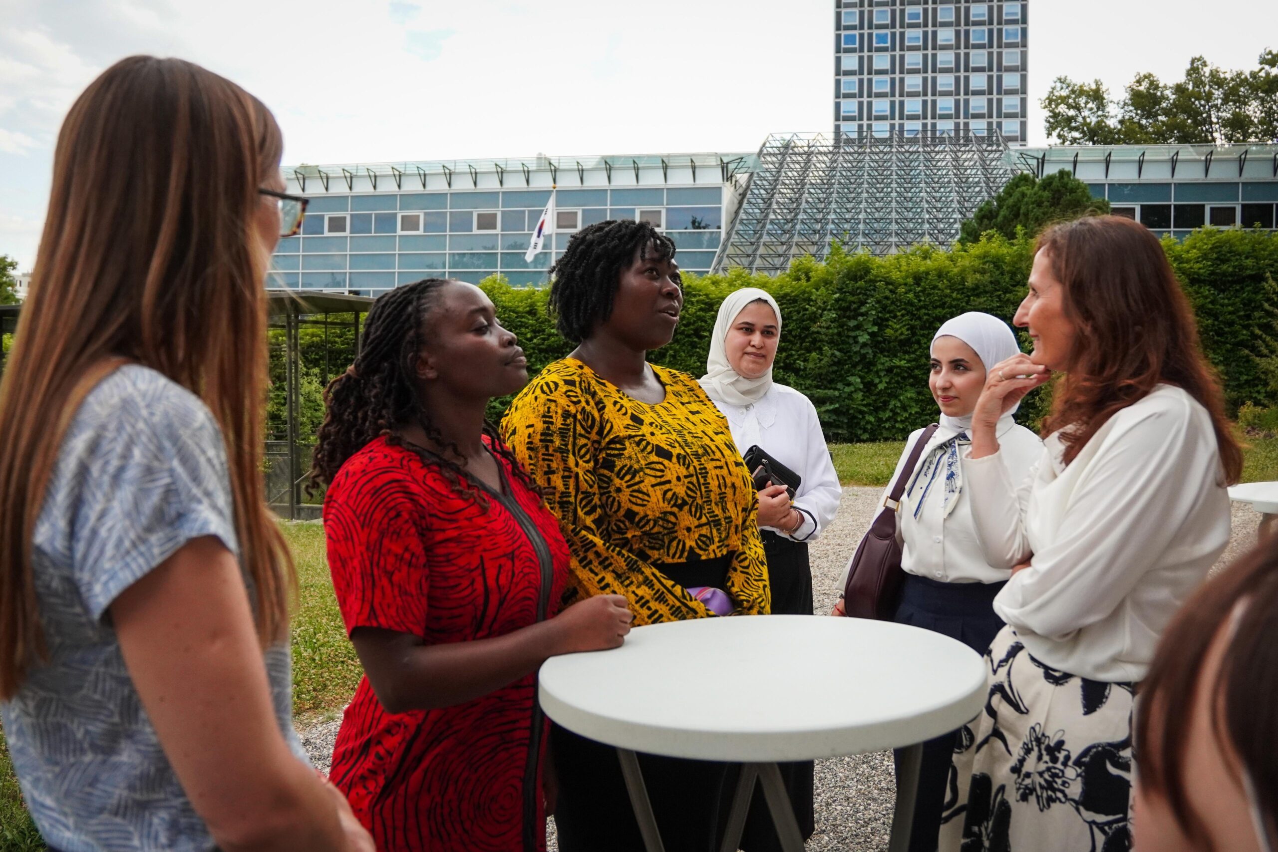 Charlotte, Head of the Plan International Liaison Office at the UN in Geneva, with She Leads delegates, engaging with H.E. Anita Pipan, Permanent Representative of the Republic of Slovenia.