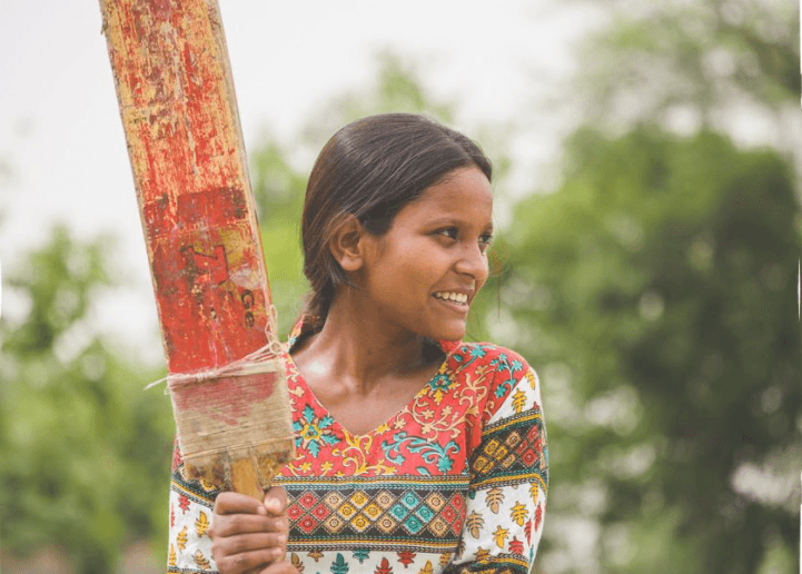 Girl smiling while playing