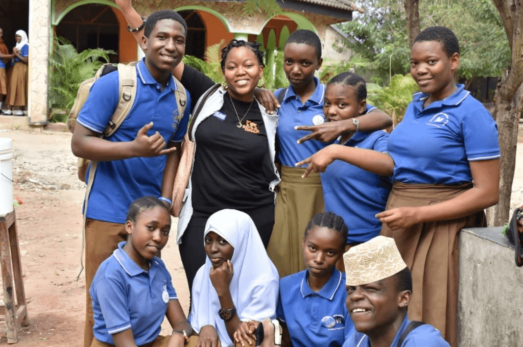 Young people posing for camera.