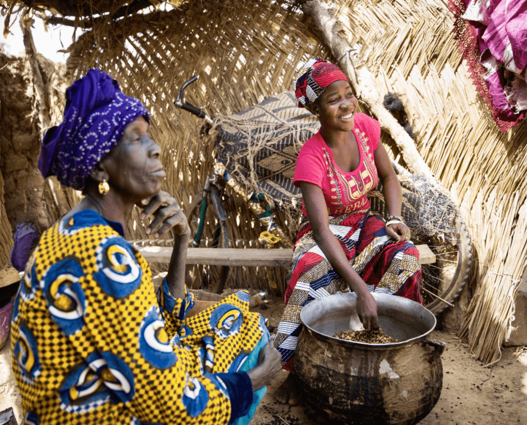 Girl, 13, with her grandmother at her home in Koulikoro region, Mali