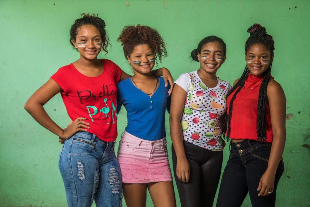 Girls smiling together.