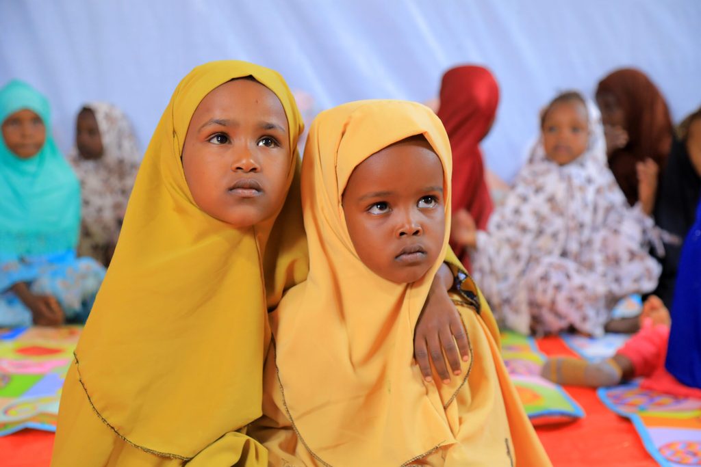 Two child girls in one of Plan International's Child friendly space in an IDP camp in Ethiopia’s Somali region.