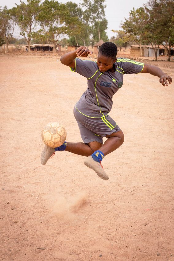 Raicha playing football.