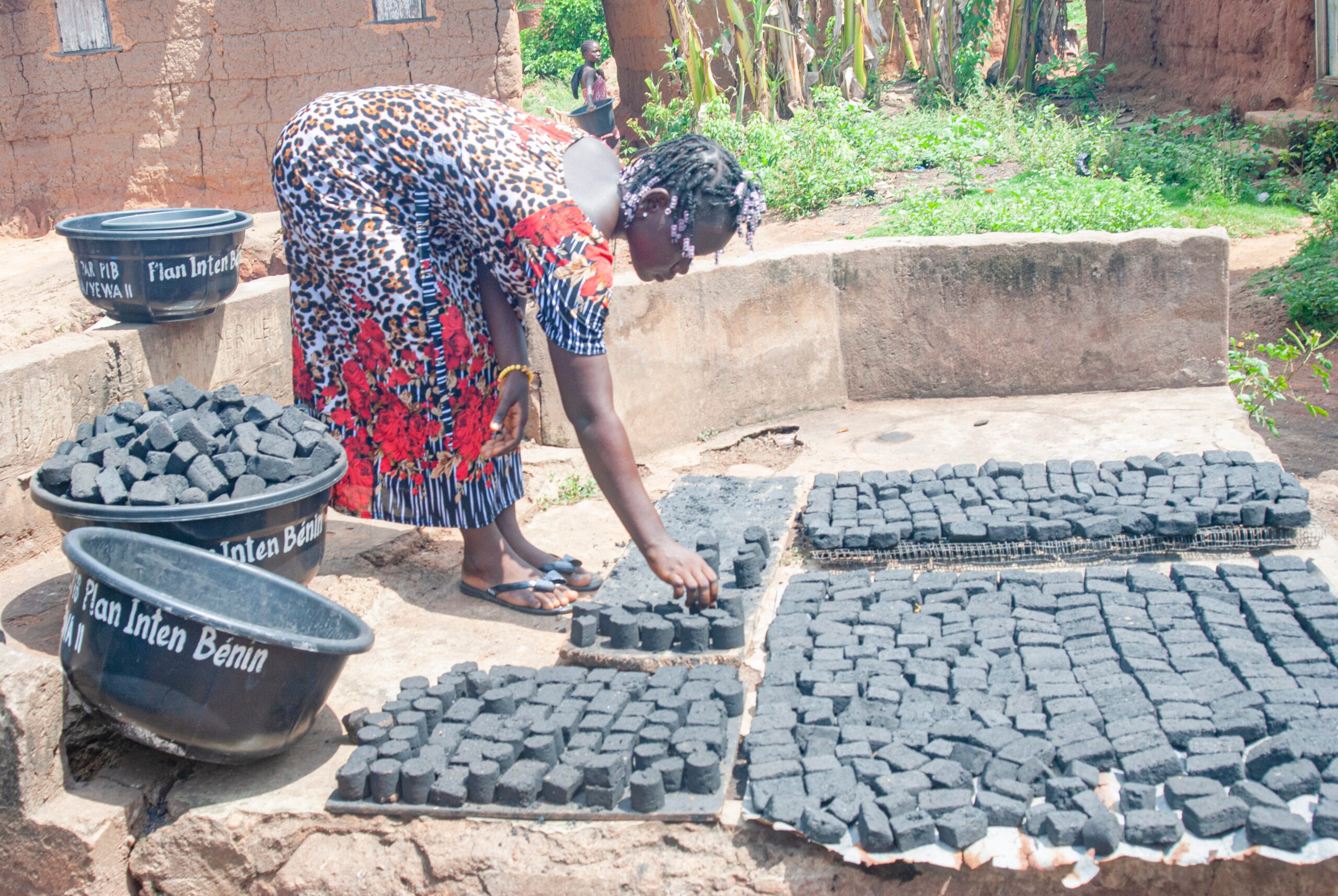 Sophie drying her pieces of ecological charcoal
