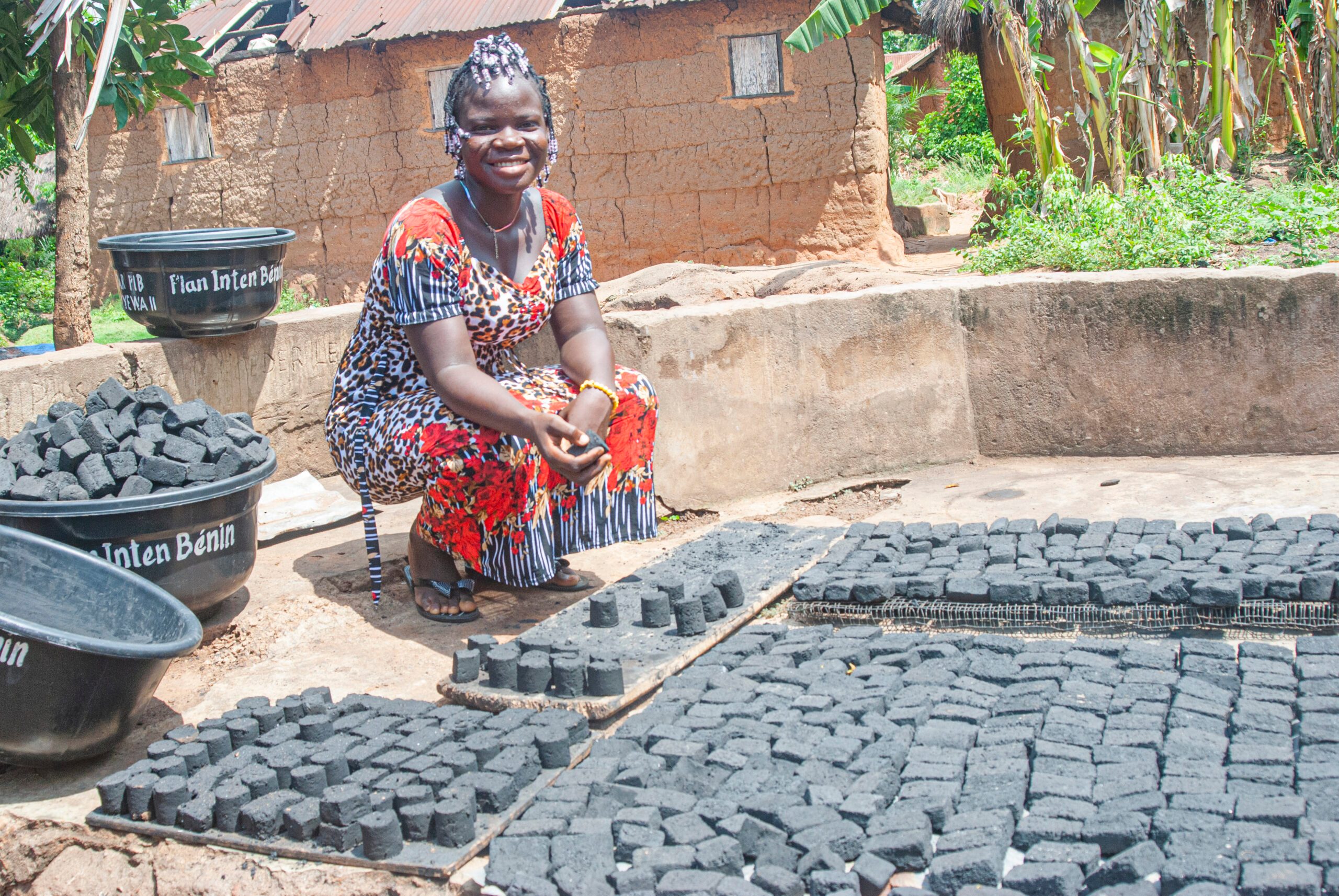 Sophie proudly showing a piece of ecological charcoal