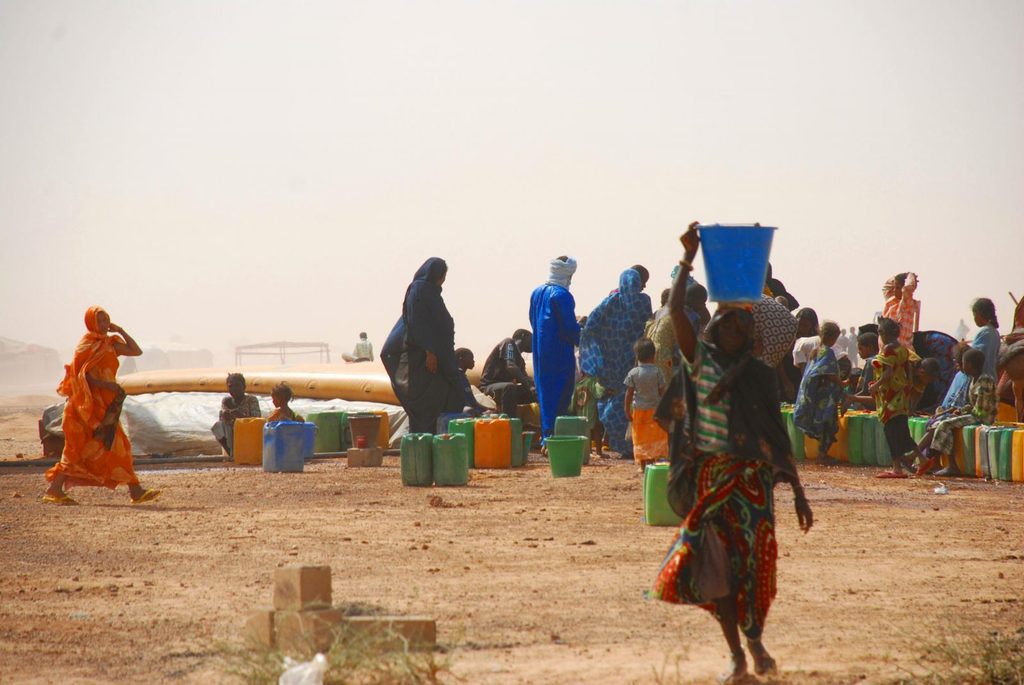 Women and children queuing for water