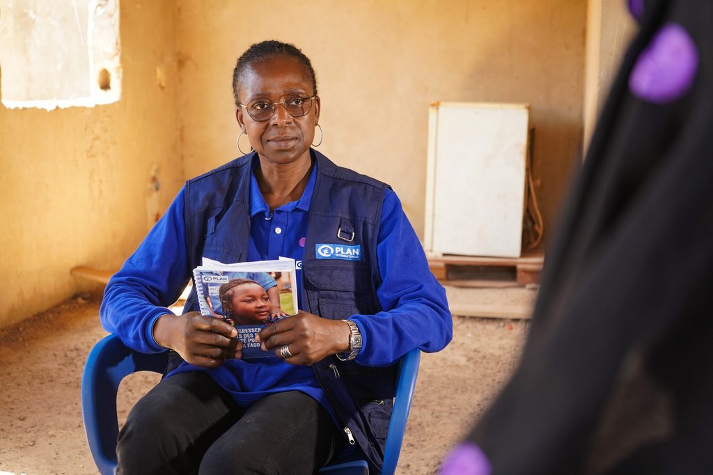 Plan International Protection Advisor Olivia visiting Saoudata to enquire about the progress of her projects.