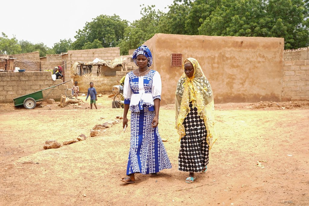 Rihanata and one of her neighbours walking in the outskirts of Kaya, Burkina Faso.