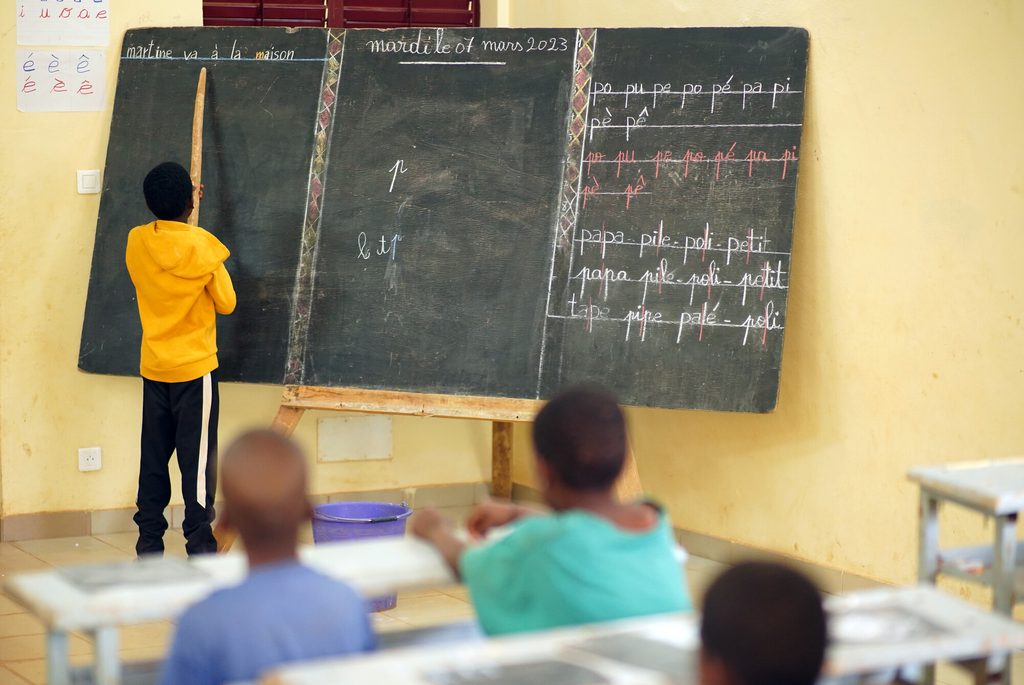 Rescued children learning in a classroom in the care centre.