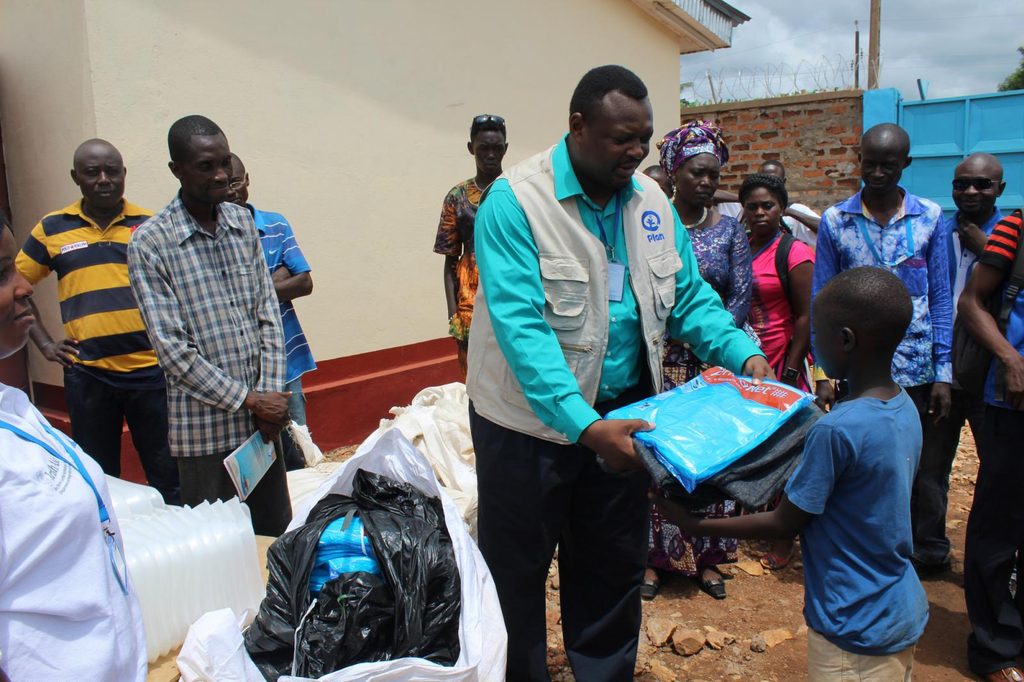 A child receiving an aid package.