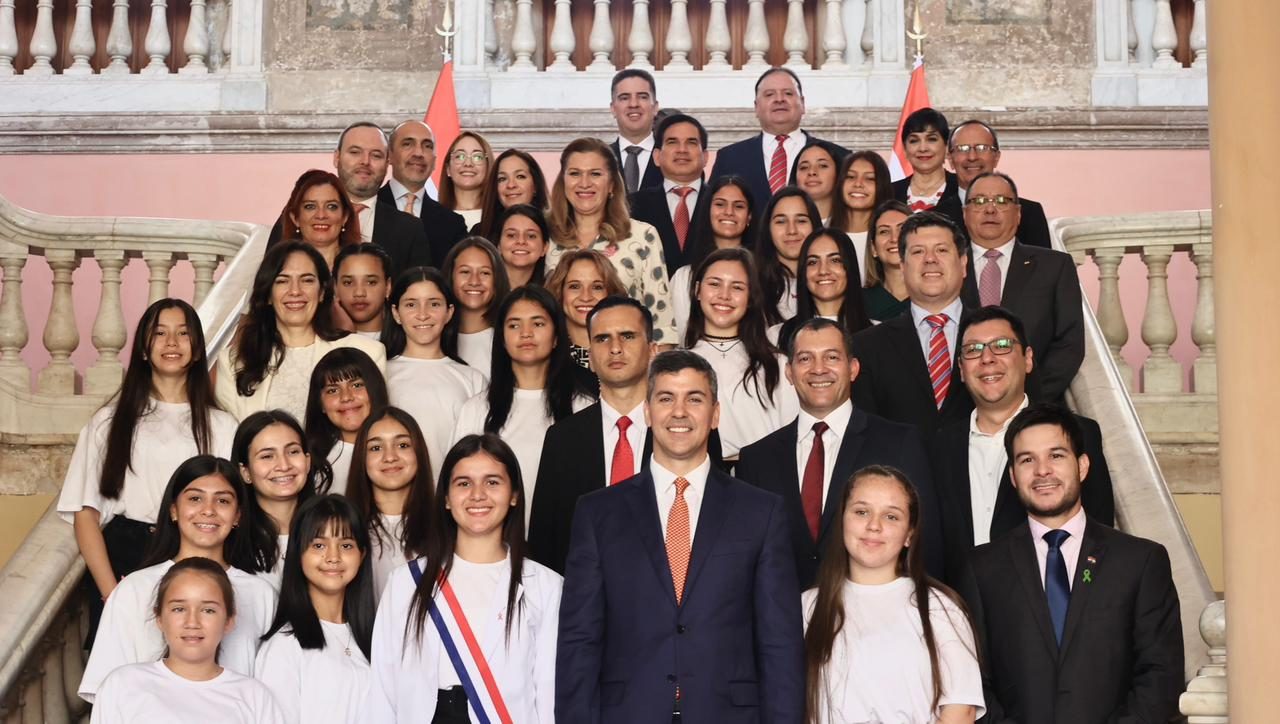 Authorities standing with the Council of Girl Ministers.