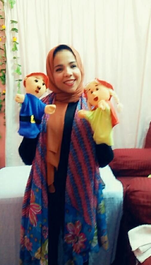 Basma with her puppets