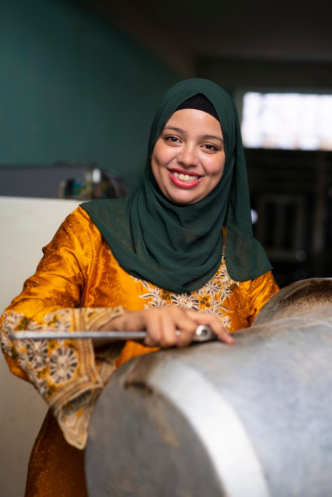 Basma fixing a washing machine drum