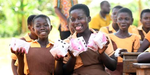 School girls receive sanitary pads to mark Menstrual Hygiene Day