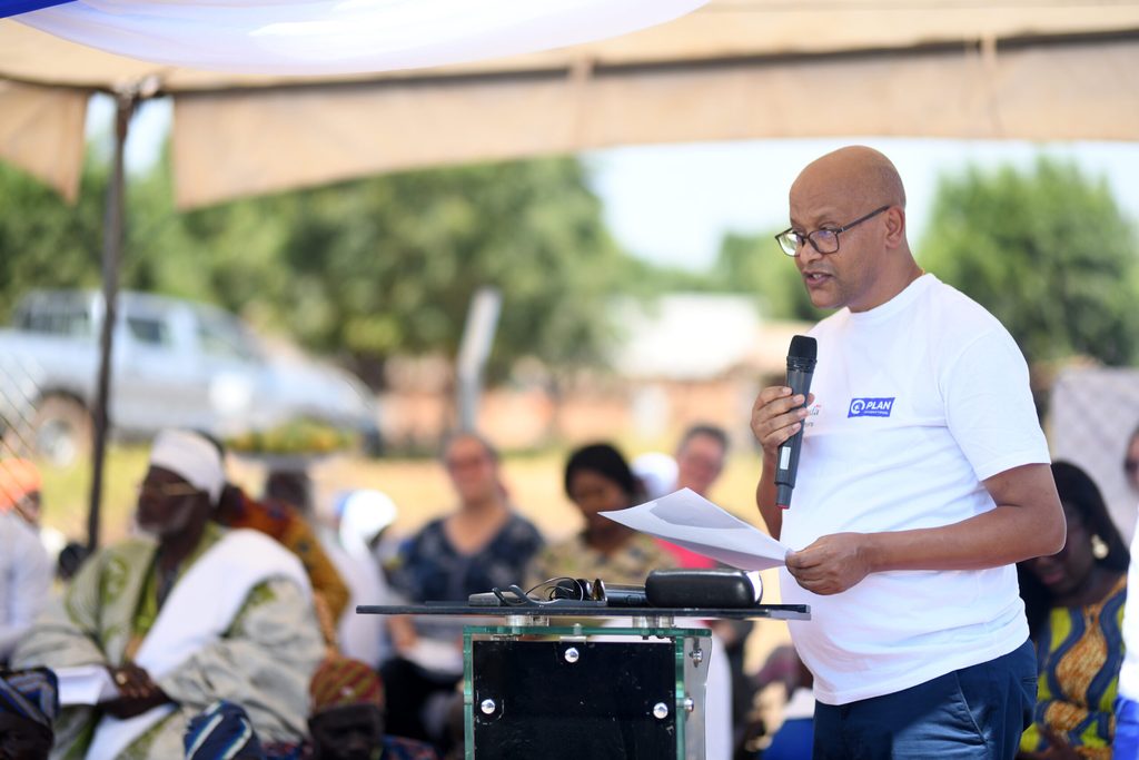 Country Director of Plan International Ghana, Mr. Solomon TesfaMariam giving a speech at the launch of the solar hub