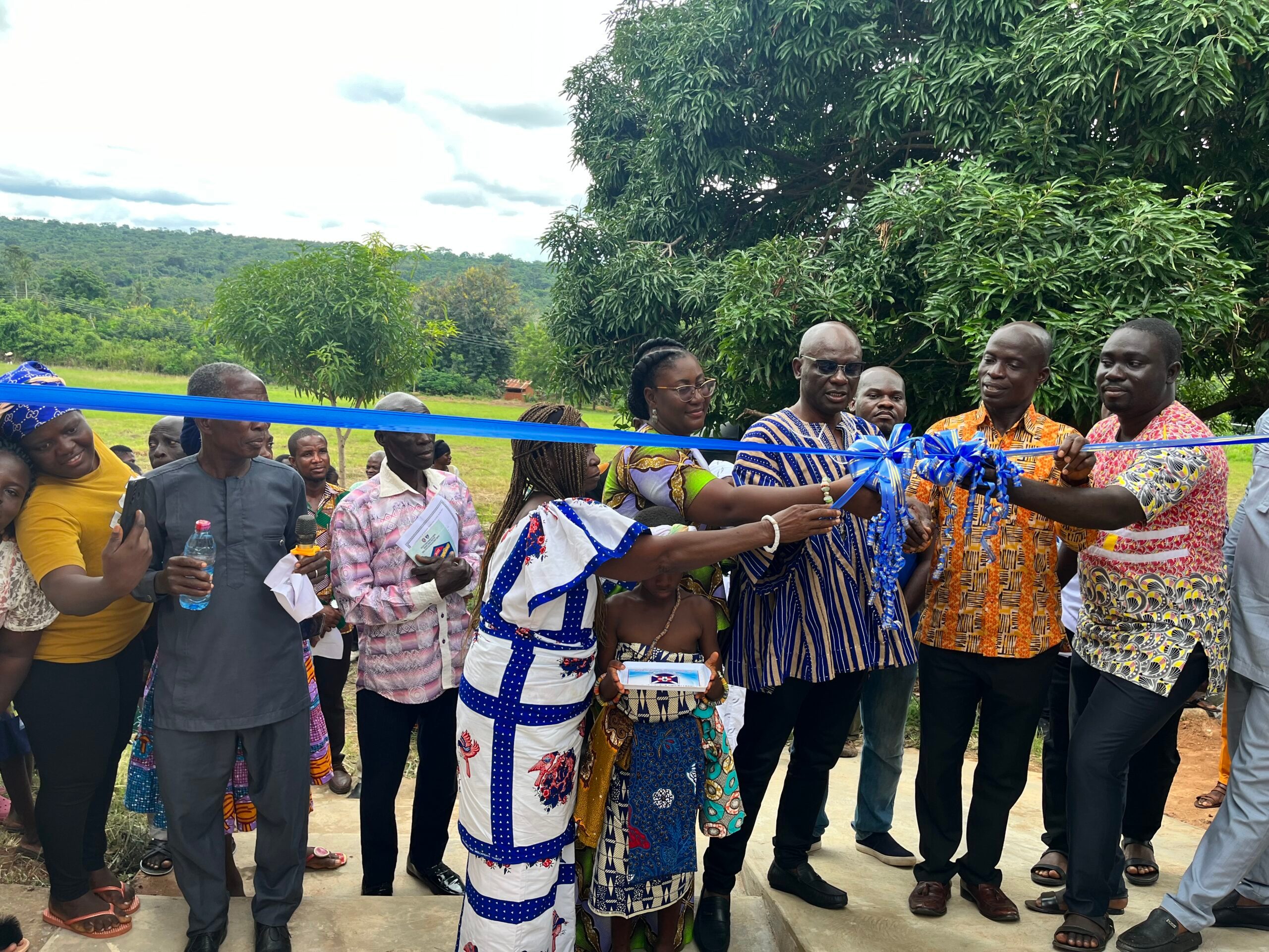 A ribbon being cut at the opening of the teachers' accomodation