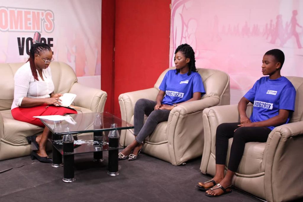 Linda and Mary sitting in chairs opposite and interviewer in an interview. 