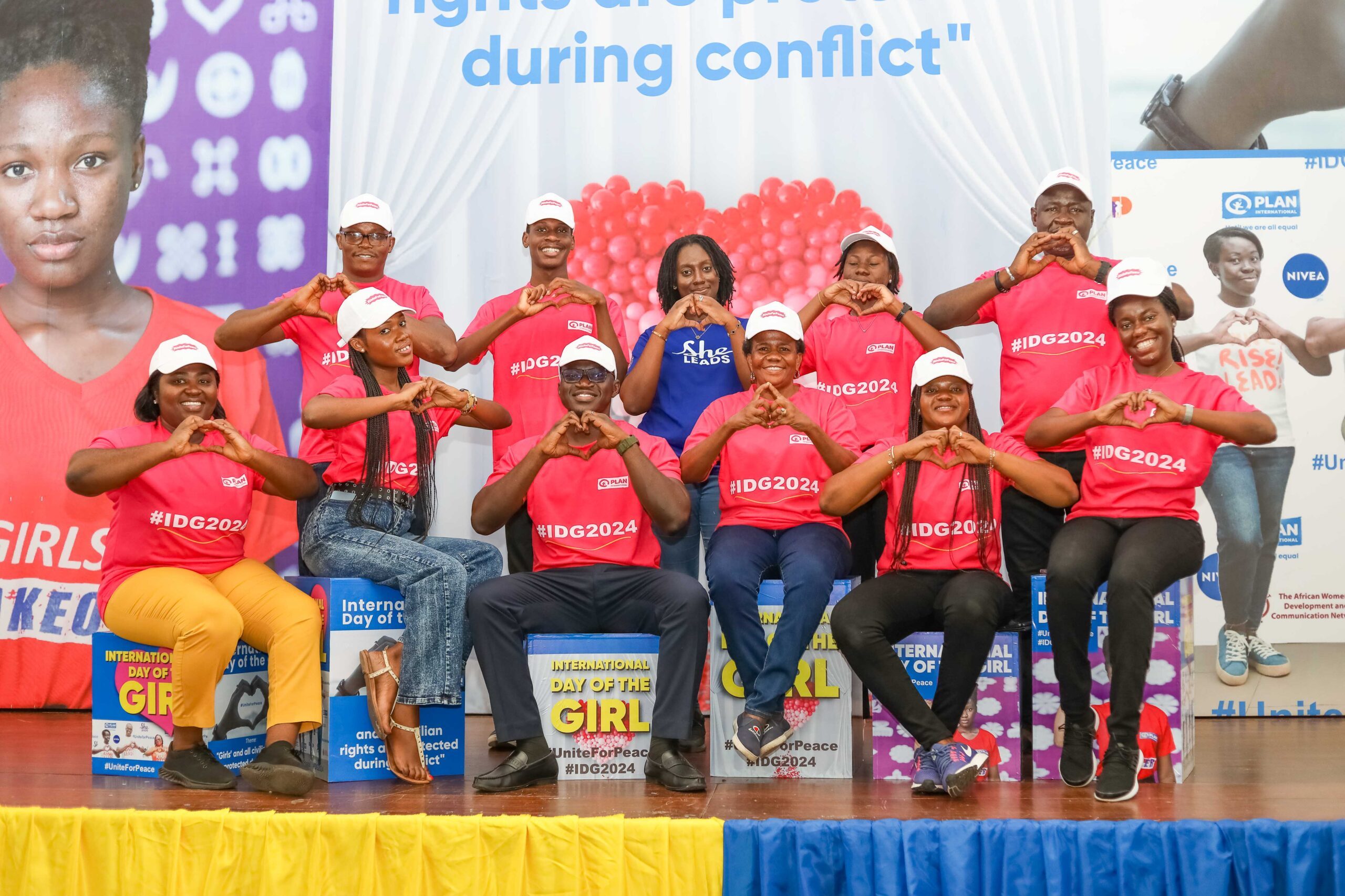 Plan International Ghana staff pose for a photo during IDG Celebration 2024.