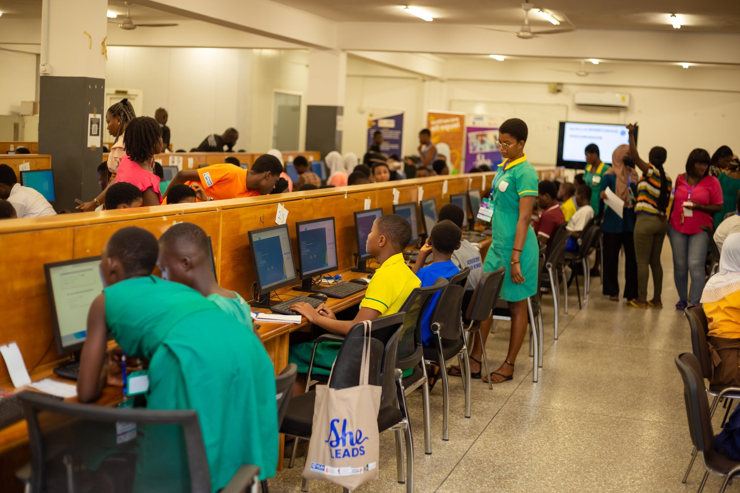 A classroom of children on computers. 