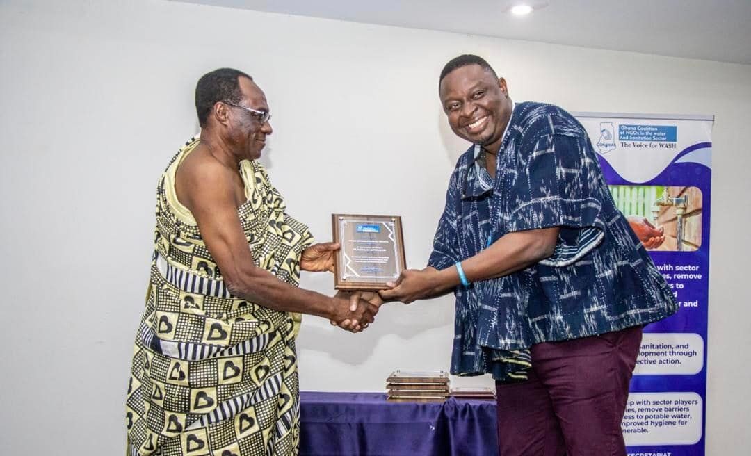 Mr. William Domapielle I-PADEV Project manager receiving the award for Plan International Ghana