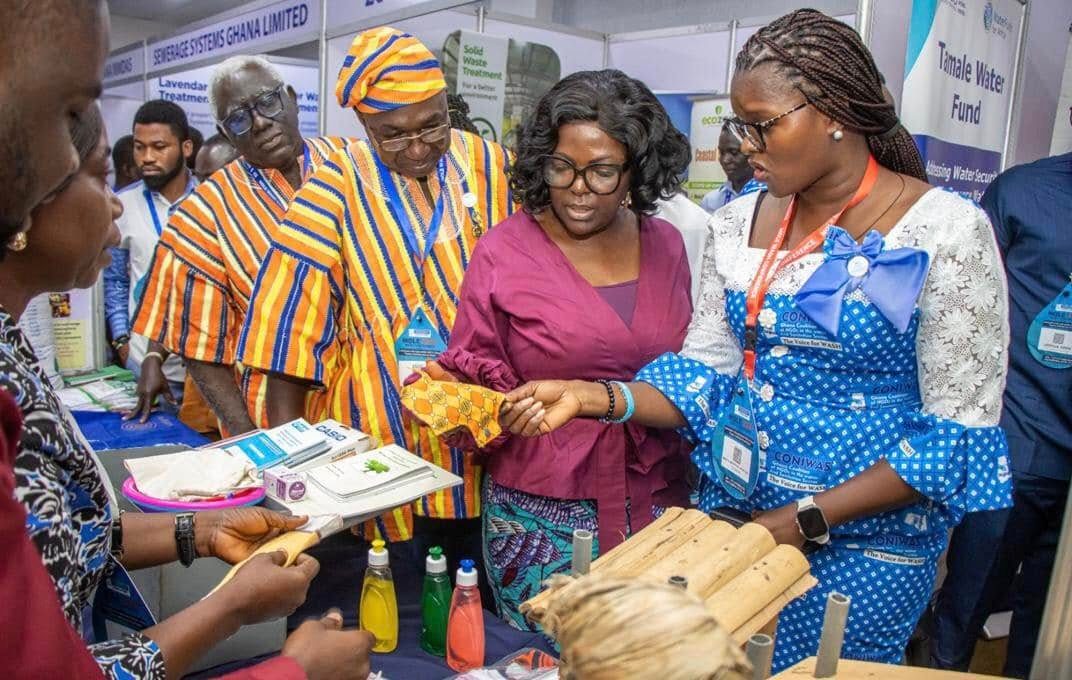 Minister of sanitation at the Plan International Ghana exhibition booth