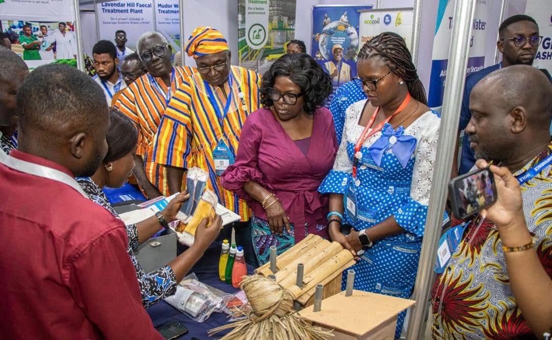 Minister of sanitation at the Plan International Ghana exhibition booth