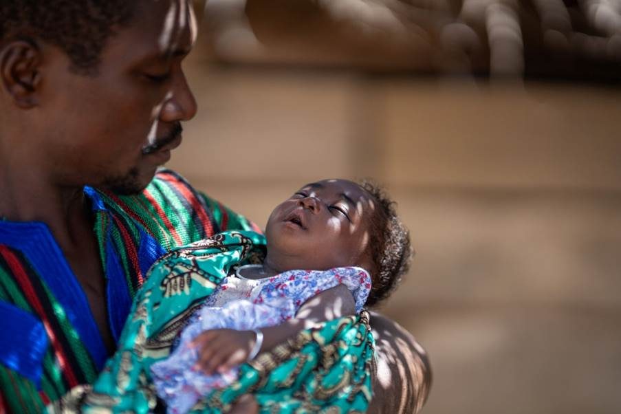 Agbeko holding his grand-daughter. 