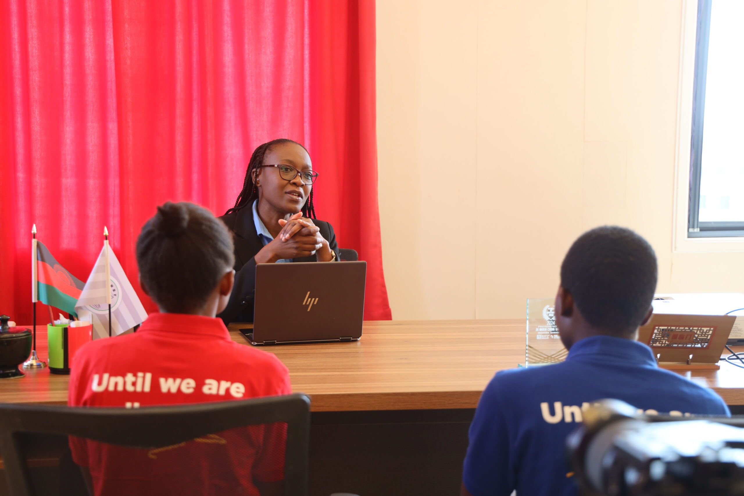 Funny and Margaret being briefed by Dr. Marion Chirwa Kajombo.