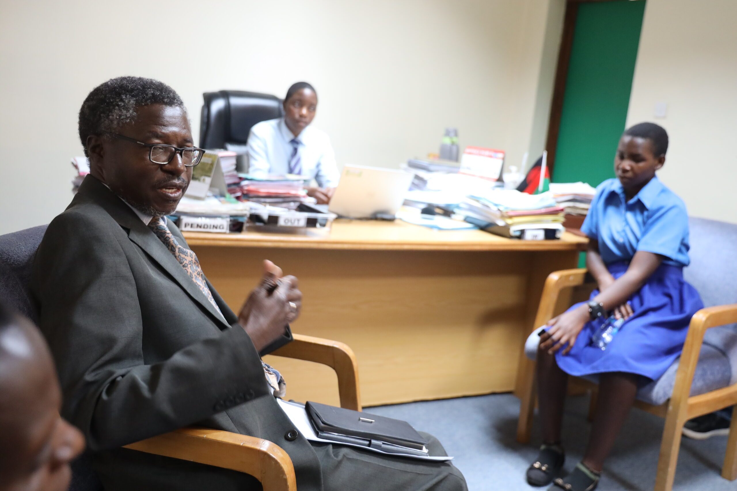 MZUNI Deputy VC interacting with the girls who took over his office