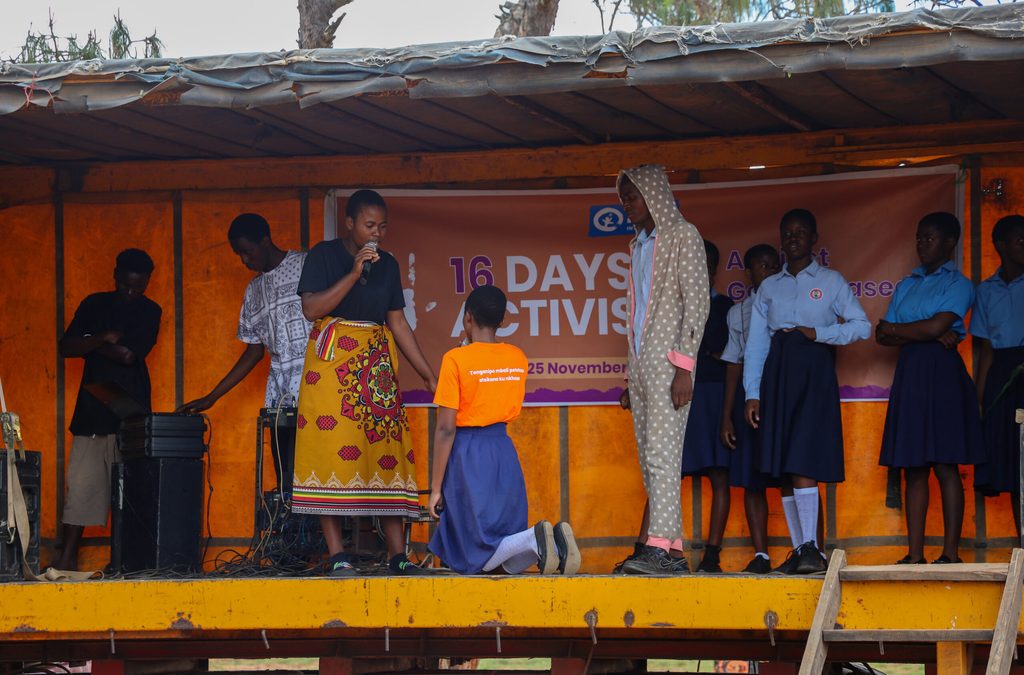 Young people performing a drama show on stage.