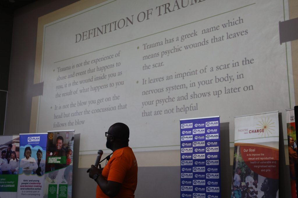 Chisangalalo Ntonio, from Alliance for Children Everywhere, making a presentation on trauma management.