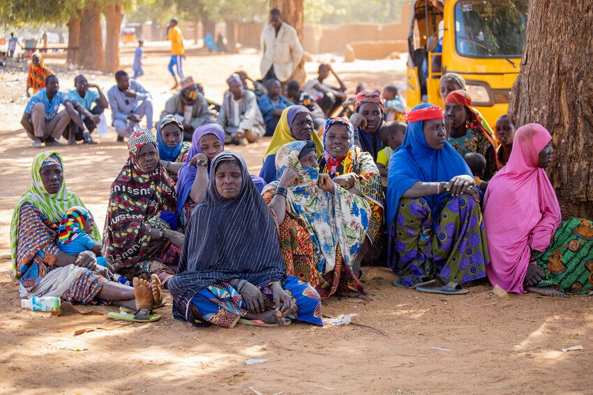 Women wait for their turn to collect food kits in Tillabéri region, western Niger. 