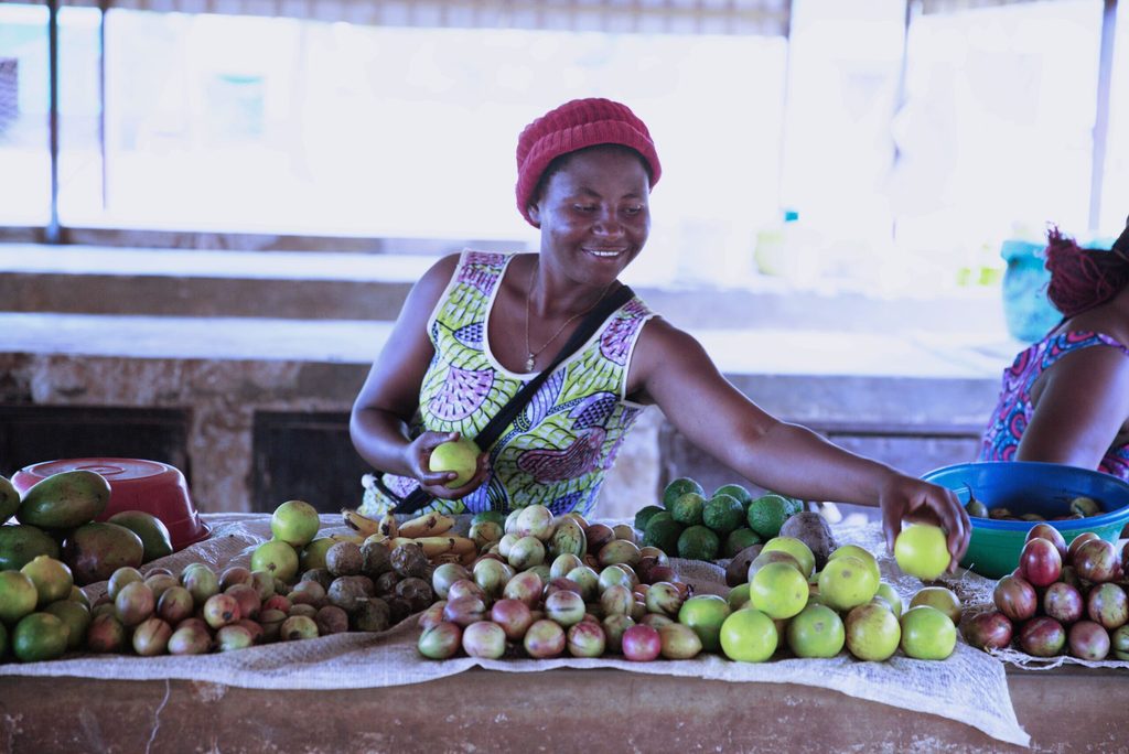 Alice's peer, Florida, selling fruits at the local market.