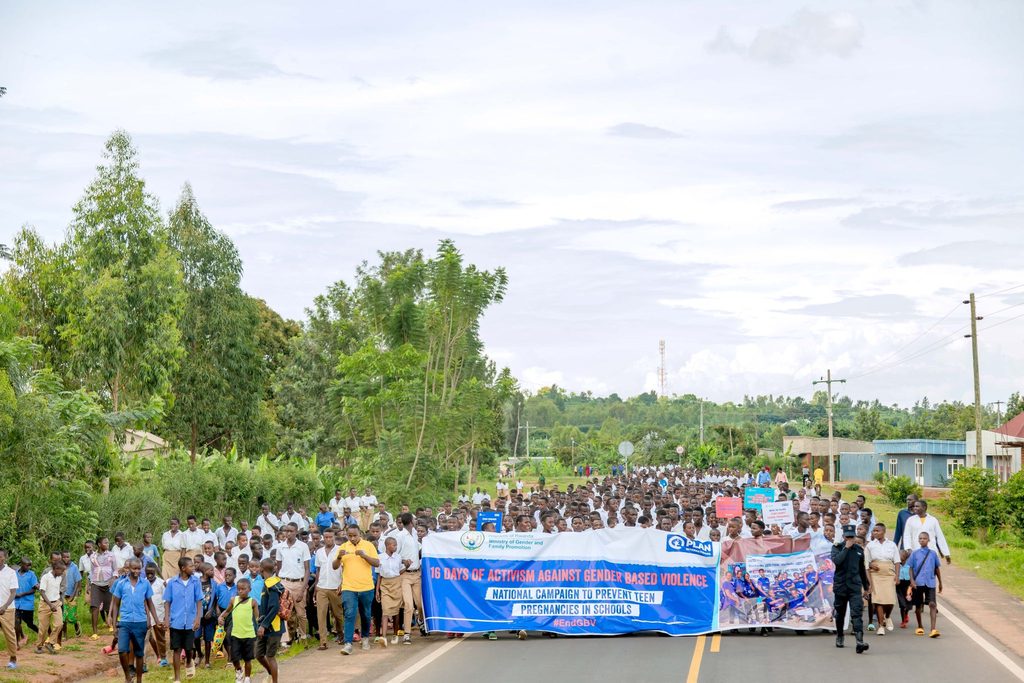 Students marching down the road as part of a school campaign against teenage pregnancies. 