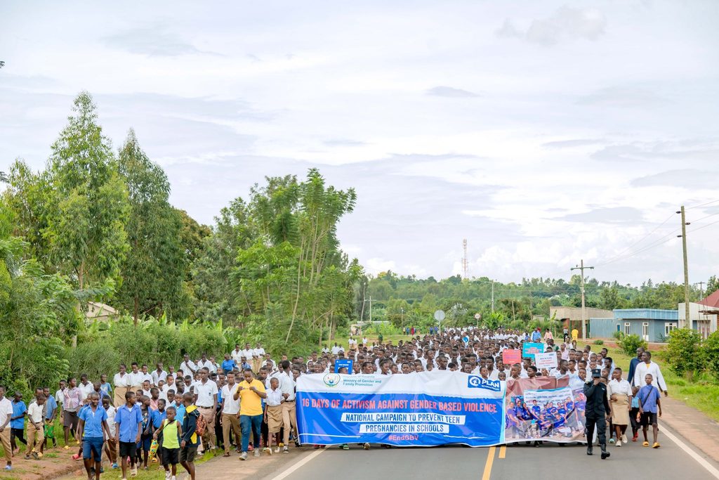Students marching down the road as part of a school campaign against teenage pregnancies.