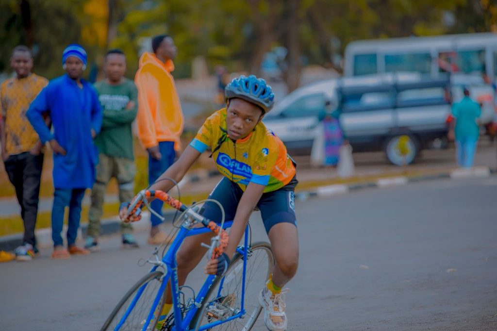 Cynthia showcasing her cycling skills during the competition.