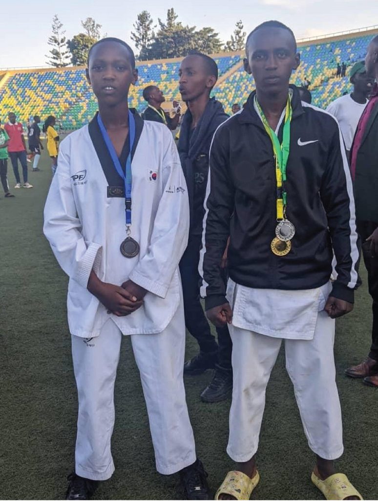 Alliance (Left) after her triumphant win of a medal at interschool karate competition.