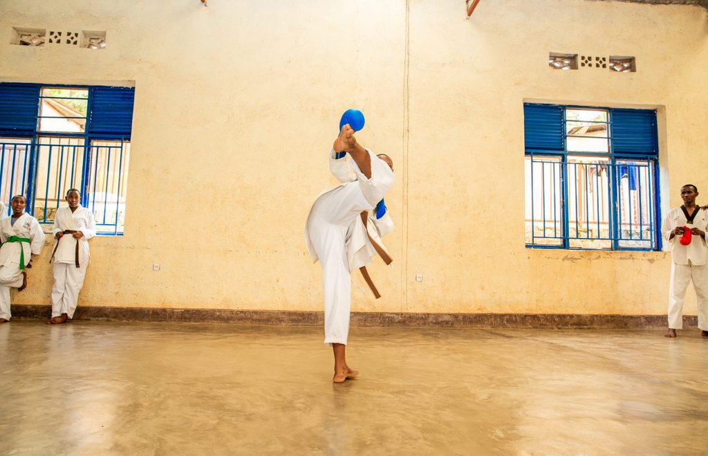 Alliance shows off her karate high kick.