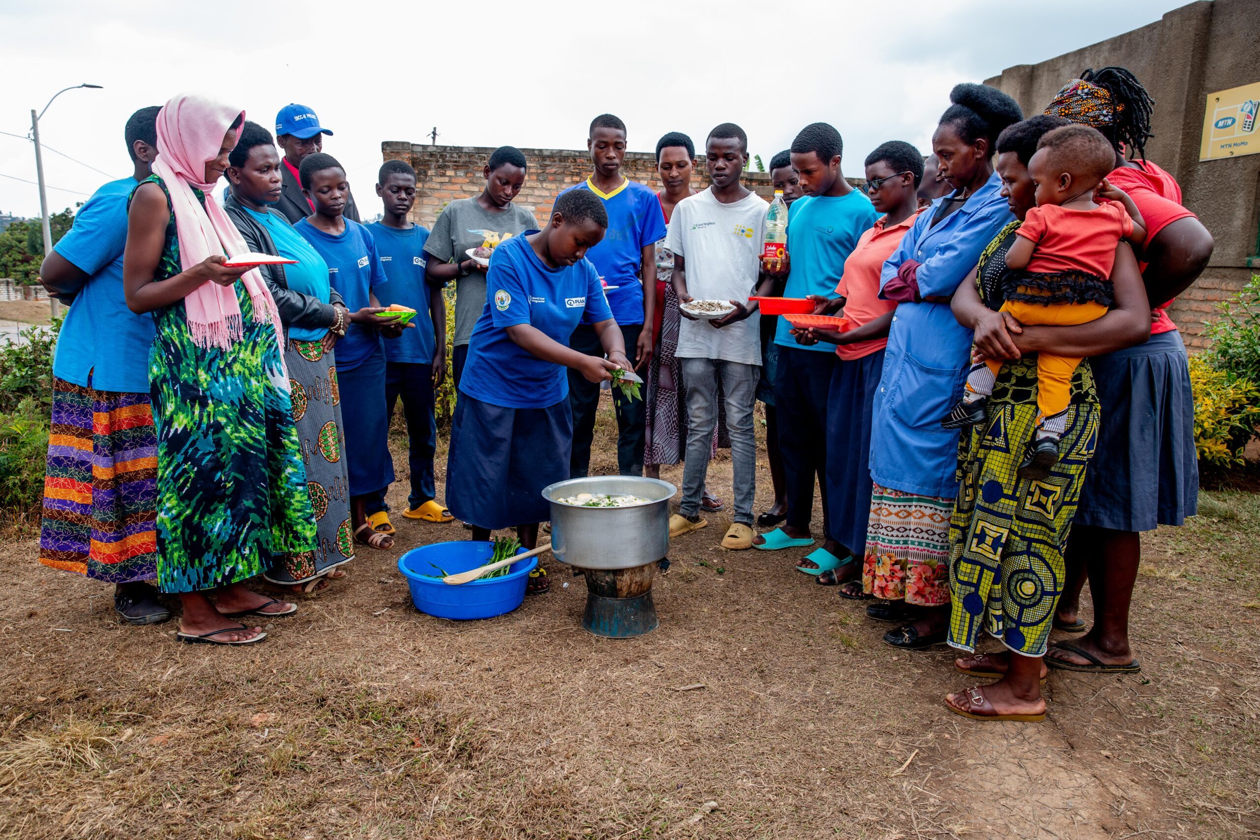 During the community cooking demonstration, foods are cooked for hands-on experience.