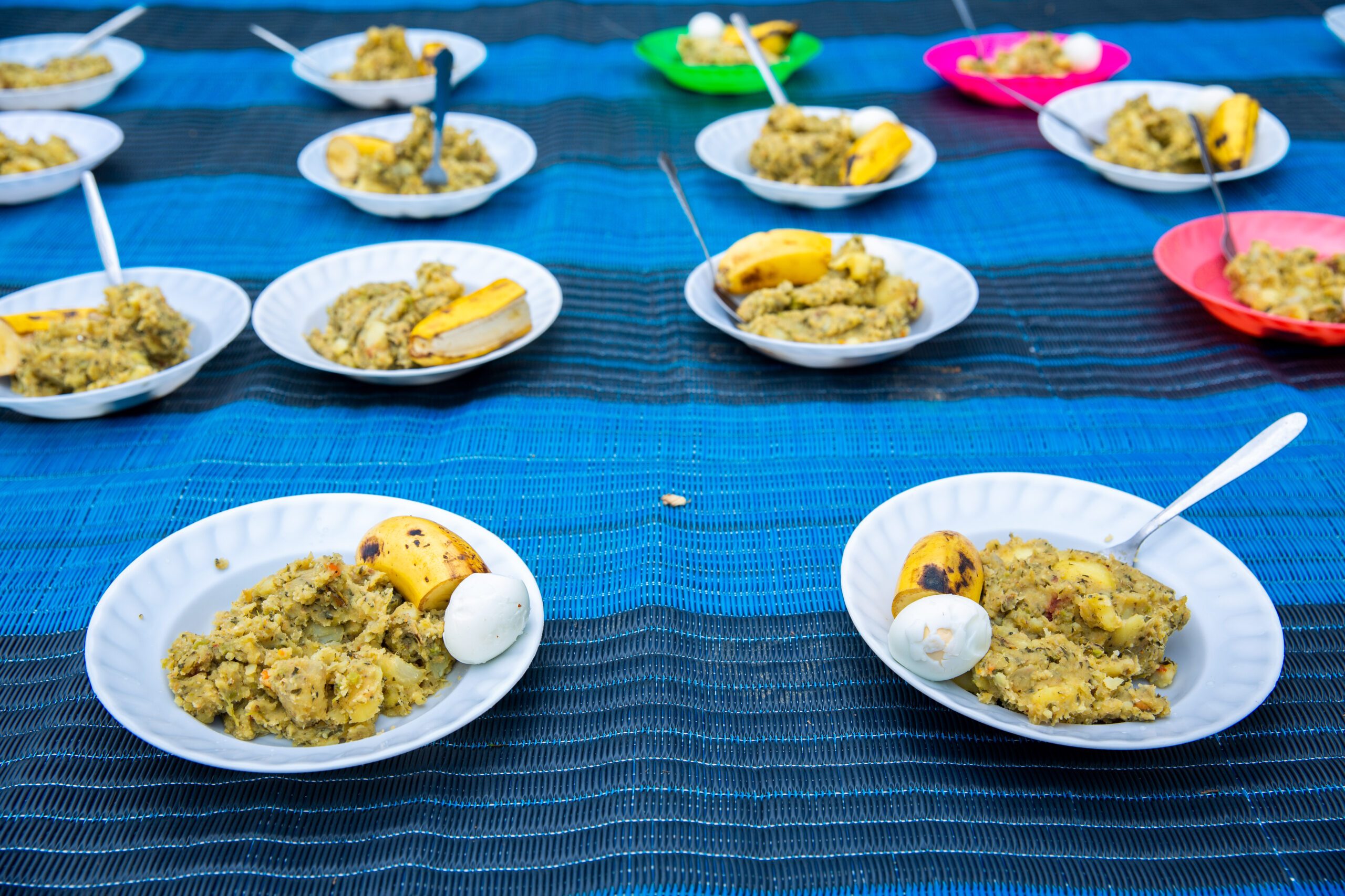 A groups of bowls full of a nutritious, balanced meal that is primarily served to vulnerable children in communities.