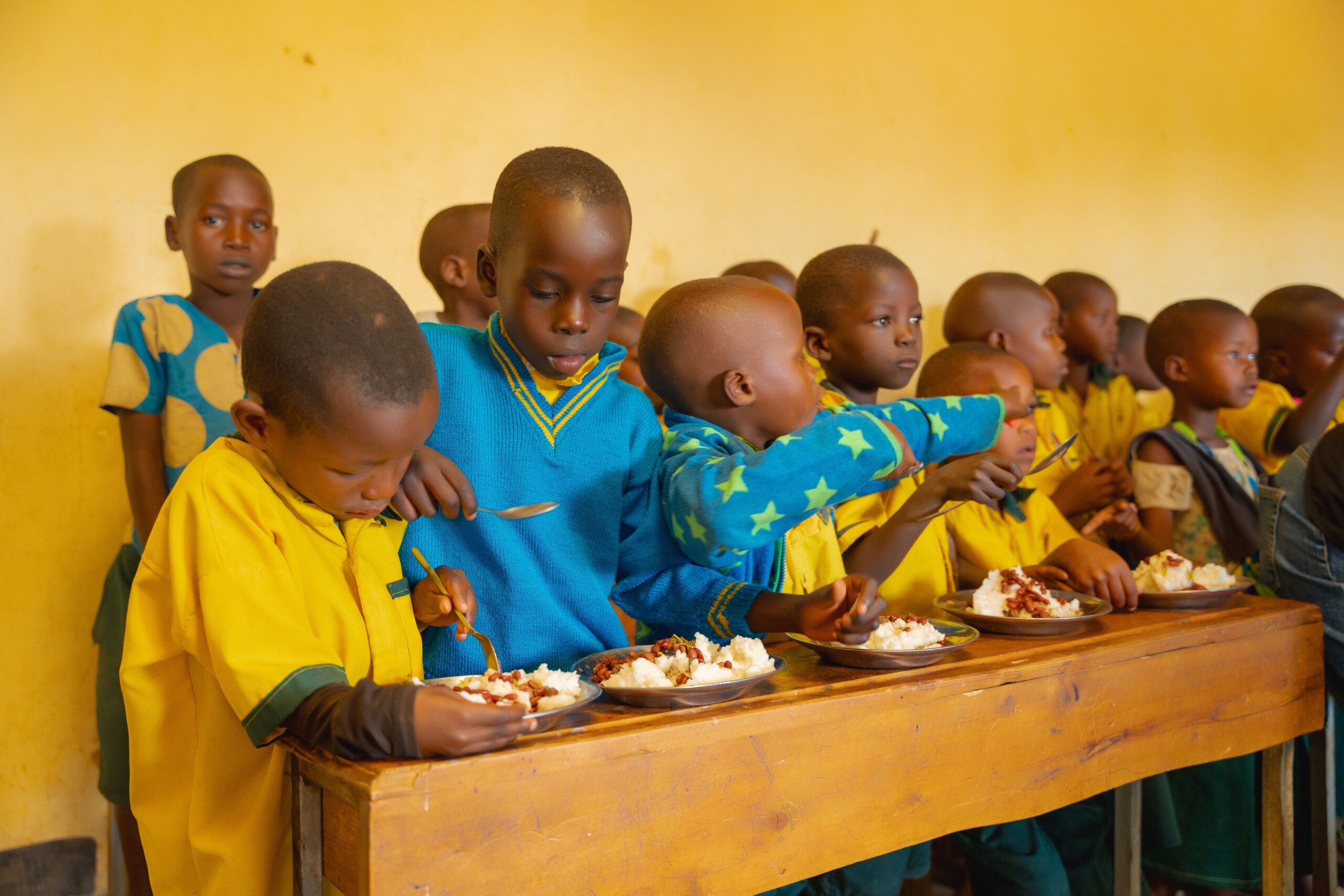 Children enjoying meals at their schools.