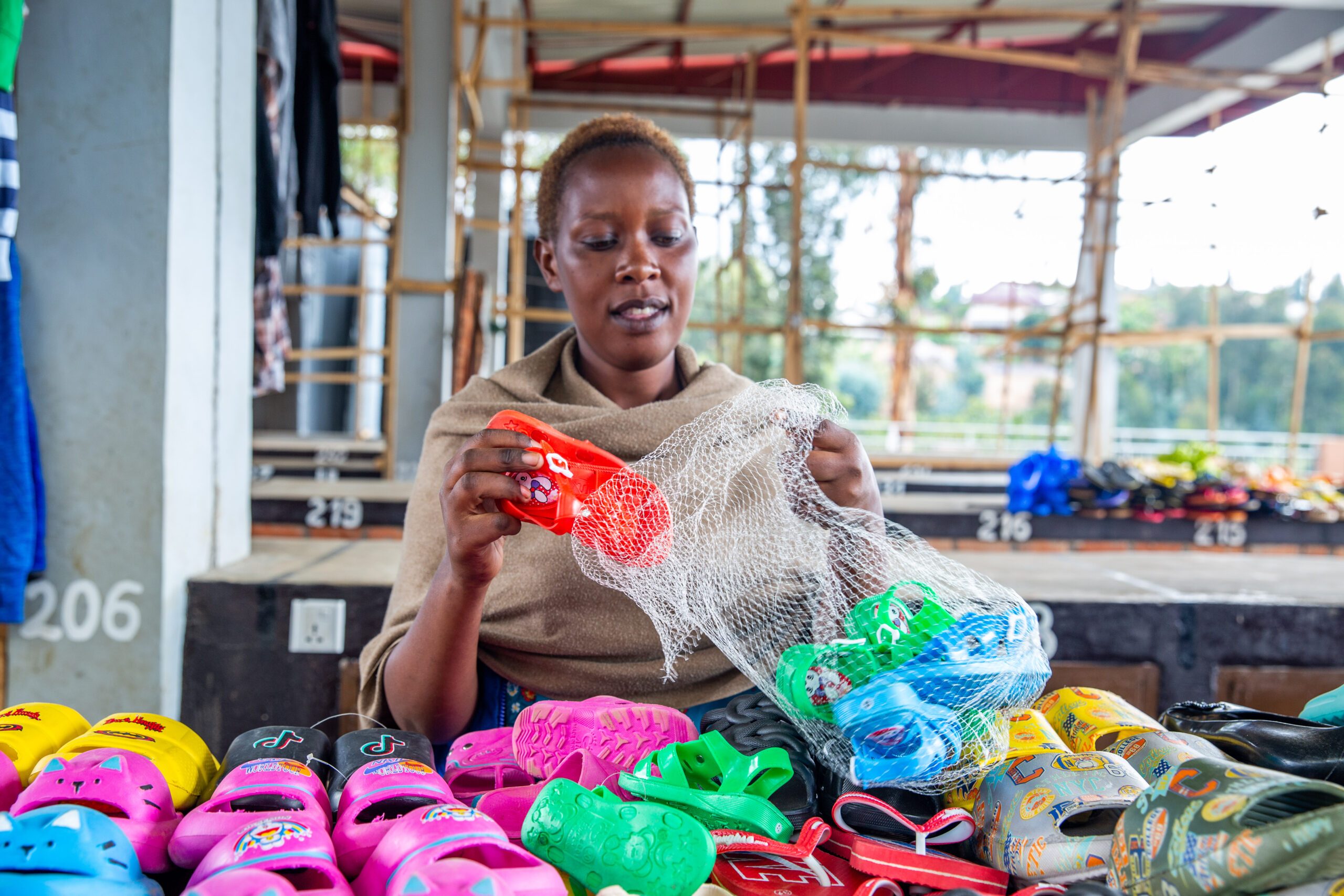 Patiente packs newly purchased shoes for sale.