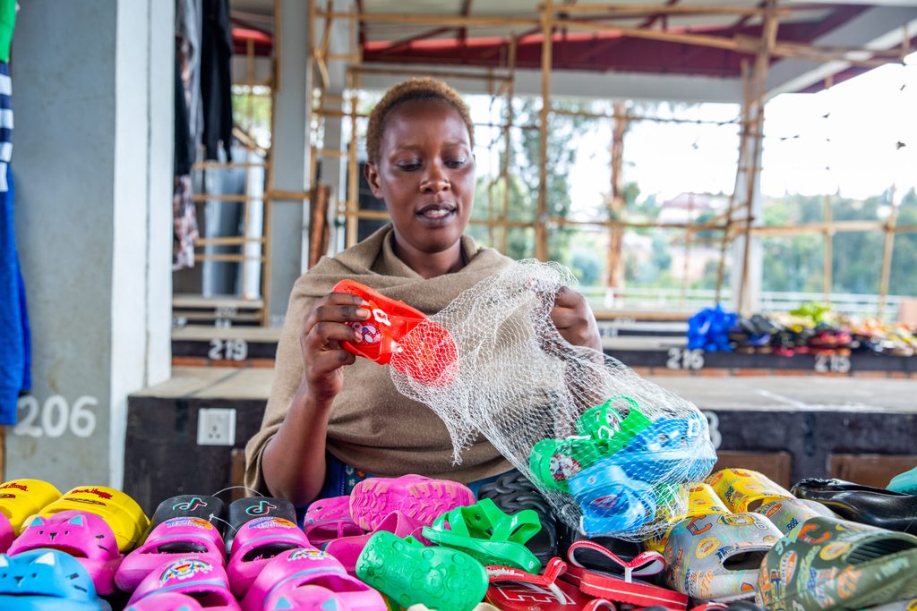 Patiente packs newly purchased shoes for sale.